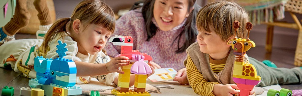 Children playing with Lego on their birthday