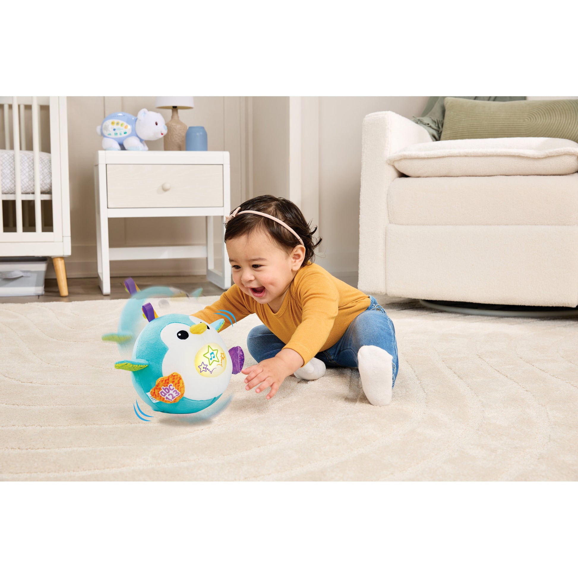 Baby playing with the LeapFrog 123 Bounce With Me Penguin toy