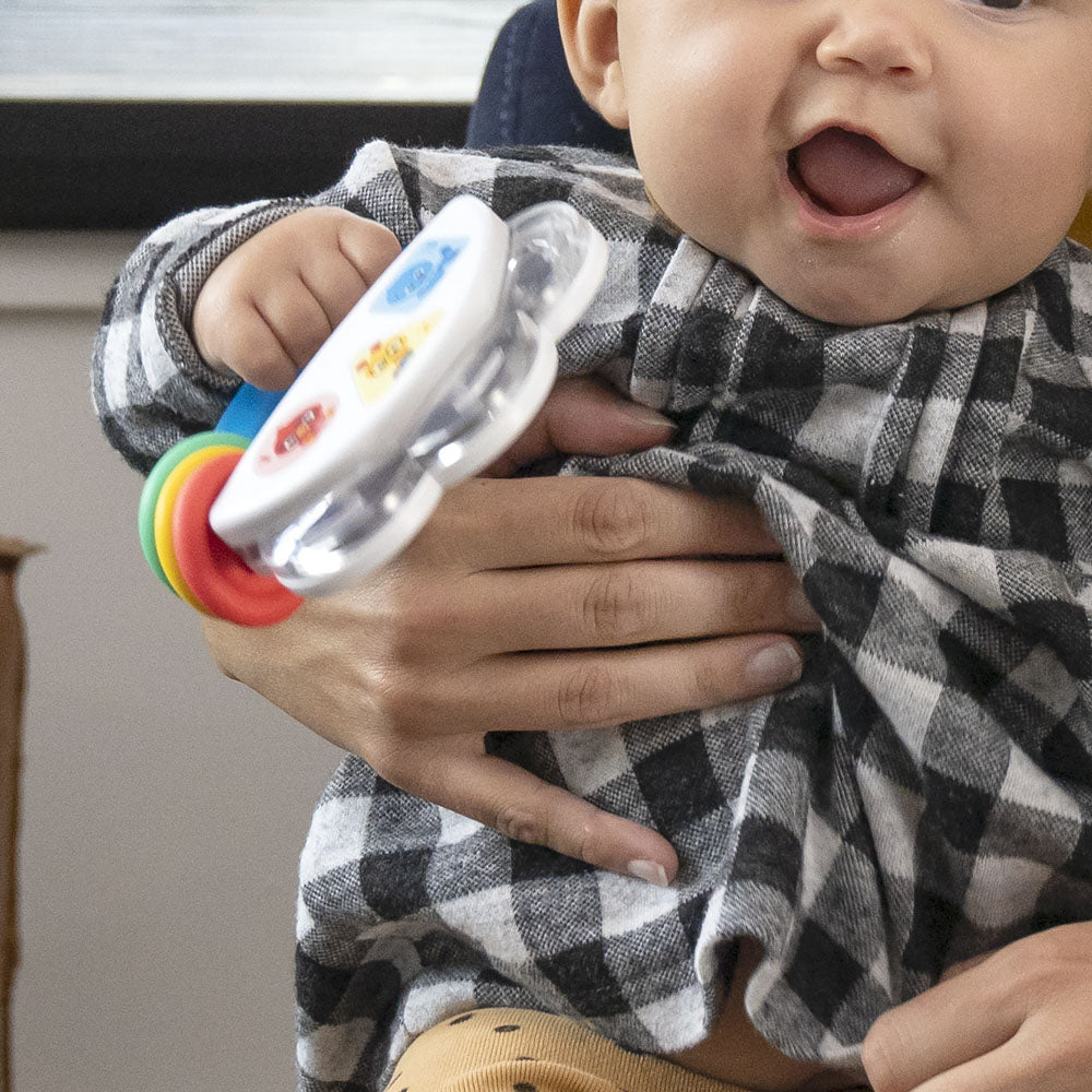 Baby holding the Baby Einstein Jingle & Jam 3 Piece Toy Gift Set