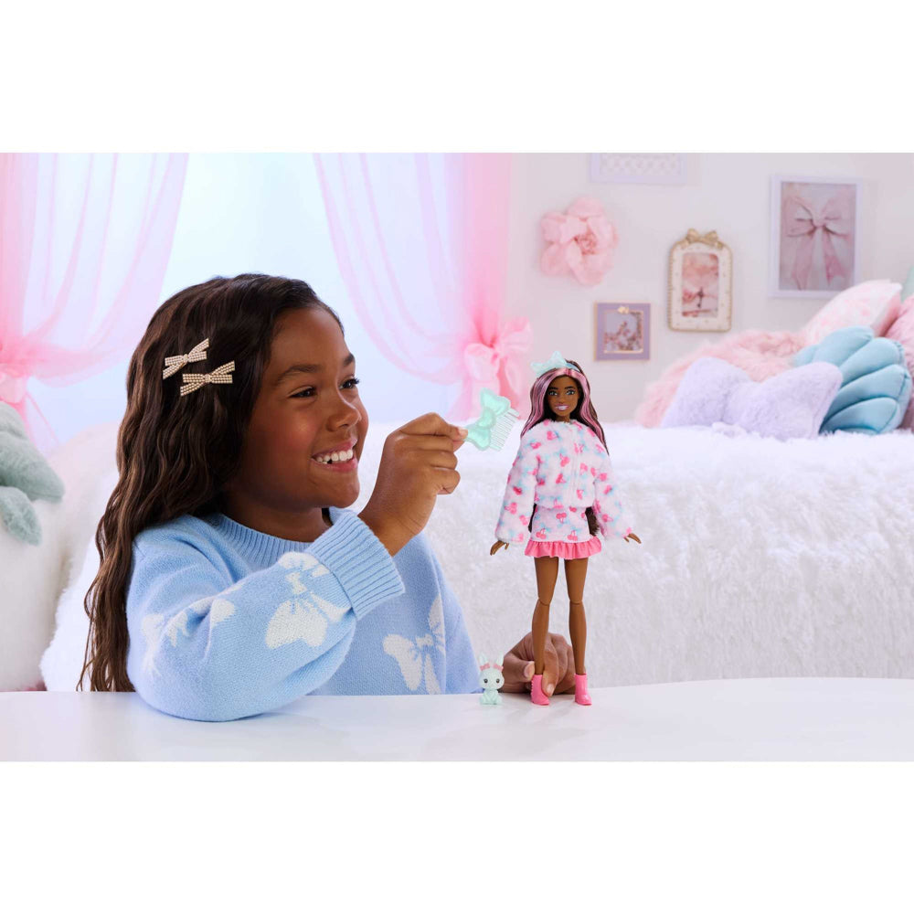 Child playing with the Barbie Cutie Doll Toy Reveal Cuddly Series - Bunny