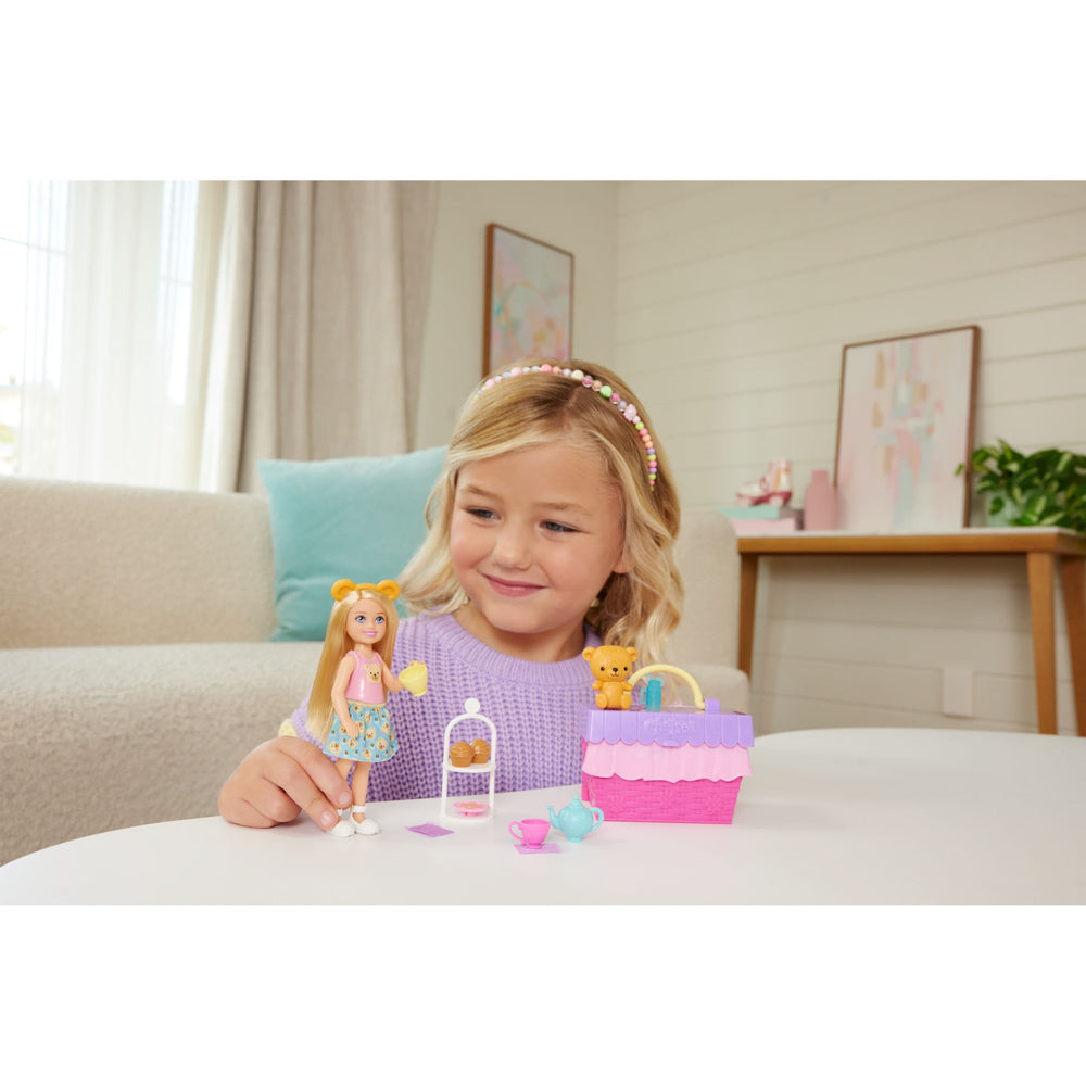 Child playing with the Barbie Family & Friends Chelsea Tea Party Picnic Playset