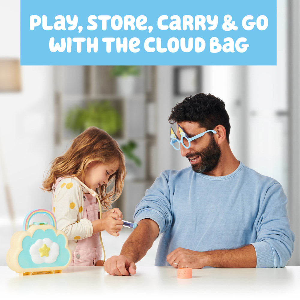Dad and daughter playing with the Bluey Cloud Bag Doctor Set including Stethoscope, Syringe, and Bandages.