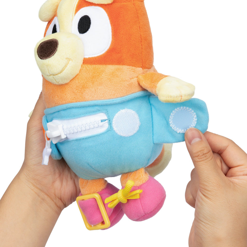 Learn how to dress, tie your shoes, buckle, zip, and use velcro, with Bluey Dress & Play Baby Bingo.
