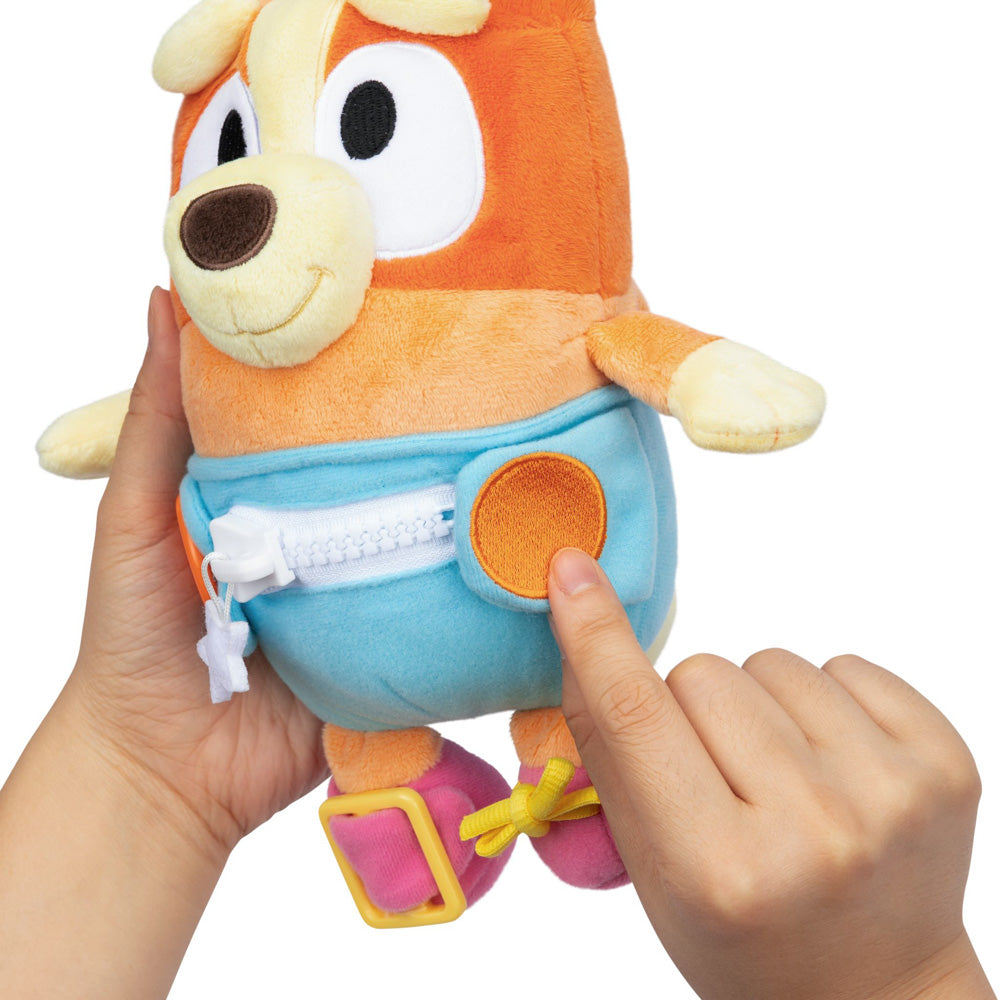Learn how to dress, tie your shoes, buckle, zip, and use velcro, with Bluey Dress & Play Baby Bingo.