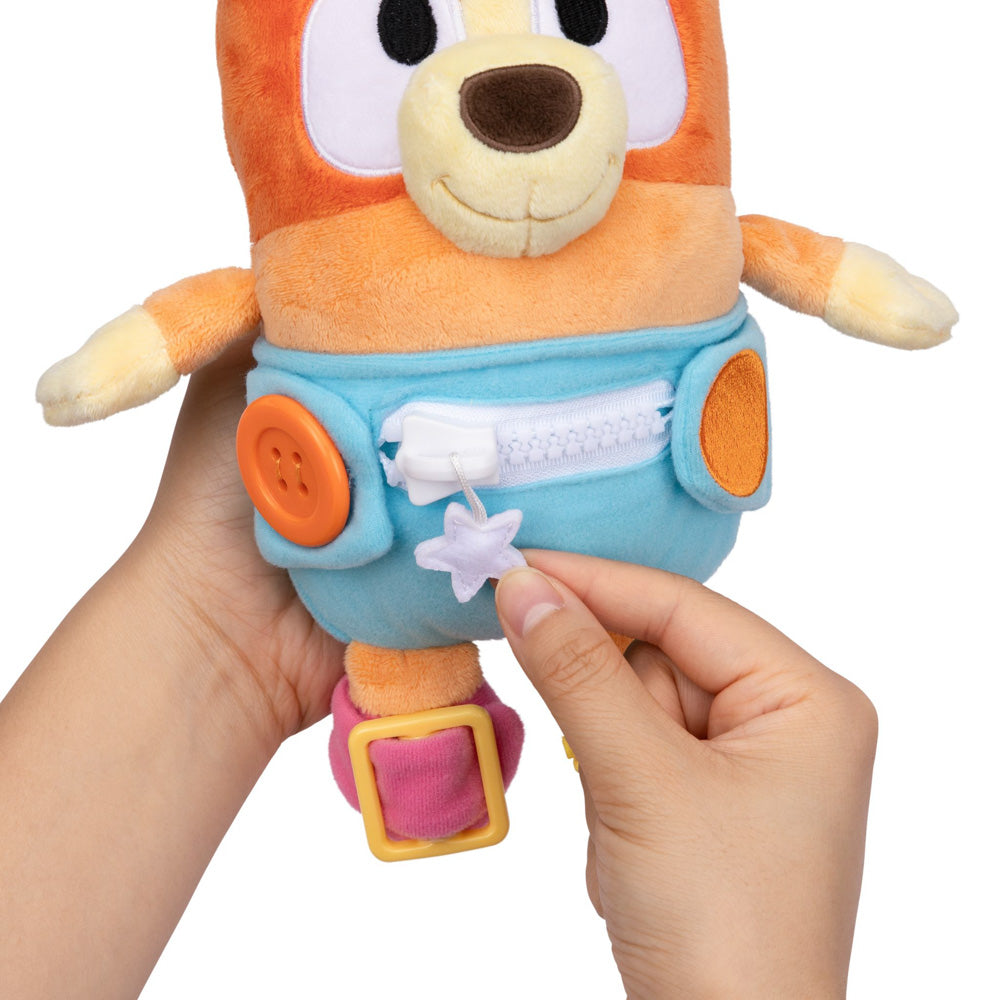 Learn how to dress, tie your shoes, buckle, zip, and use velcro, with Bluey Dress & Play Baby Bingo.