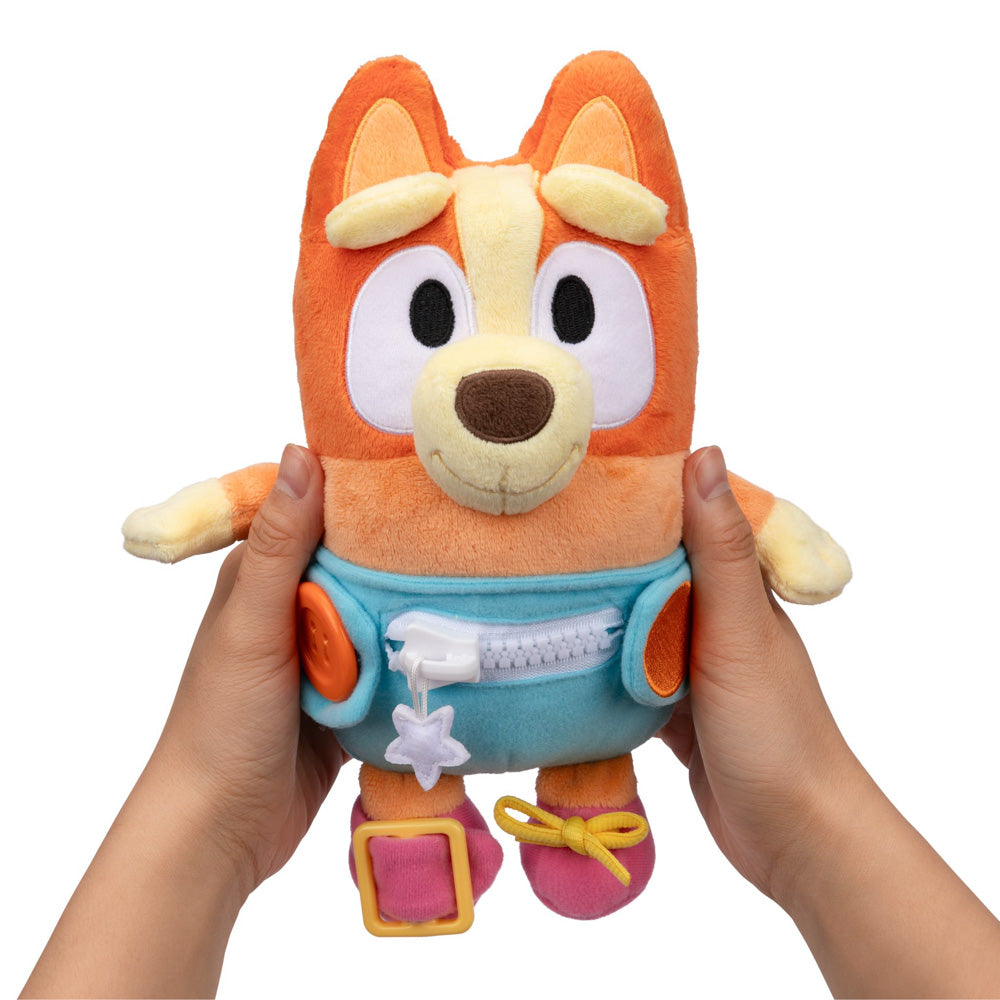 Learn how to dress, tie your shoes, buckle, zip, and use velcro, with Bluey Dress & Play Baby Bingo.