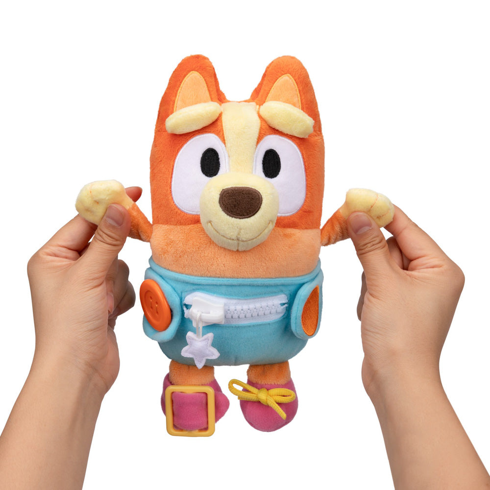 Learn how to dress, tie your shoes, buckle, zip, and use velcro, with Bluey Dress & Play Baby Bingo.