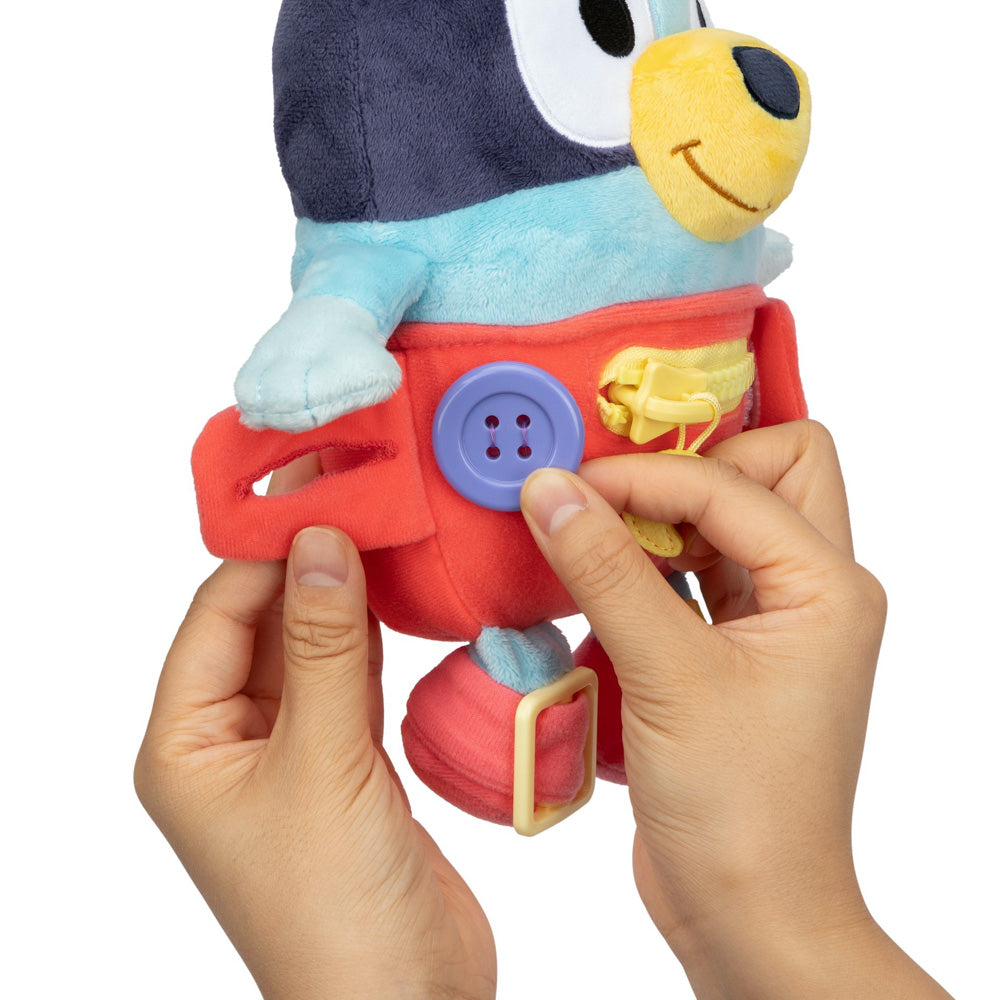 Learn how to dress, tie your shoes, buckle, zip, and use velcro, with Bluey Dress & Play plush.