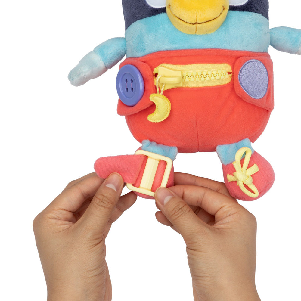 Learn how to dress, tie your shoes, buckle, zip, and use velcro, with Bluey Dress & Play plush.