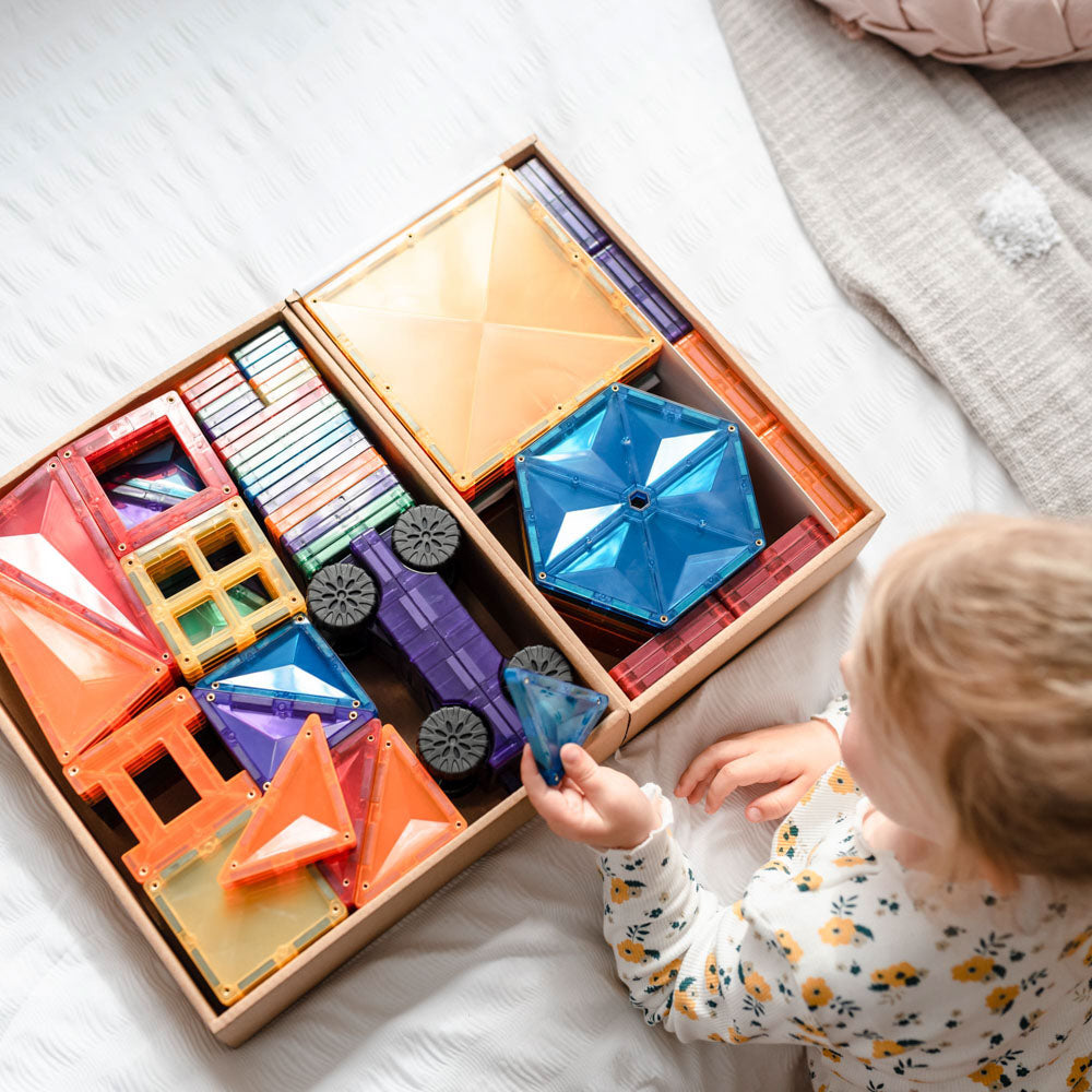 Child playing with the CONNETIX Magnetic Tiles 212 Piece Rainbow Mega Pack