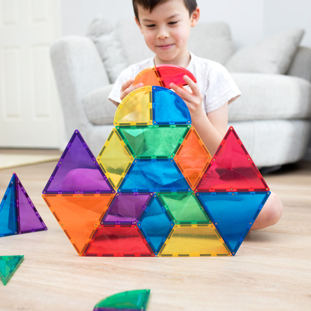 Child playing with the CONNETIX Magnetic Tiles 36 Piece - Rainbow Expansion Pack