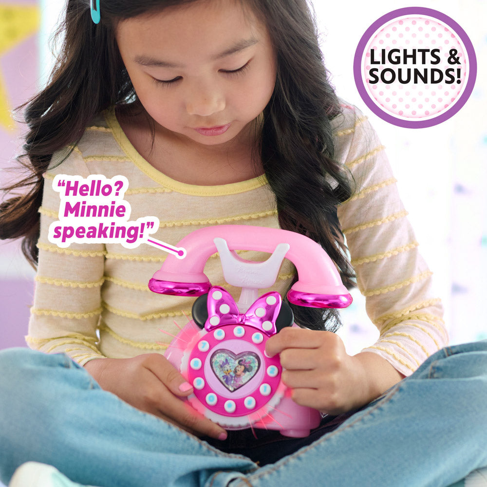 Child playing with the Disney Junior Minnie Mouse Ring Me Rotary Play Phone