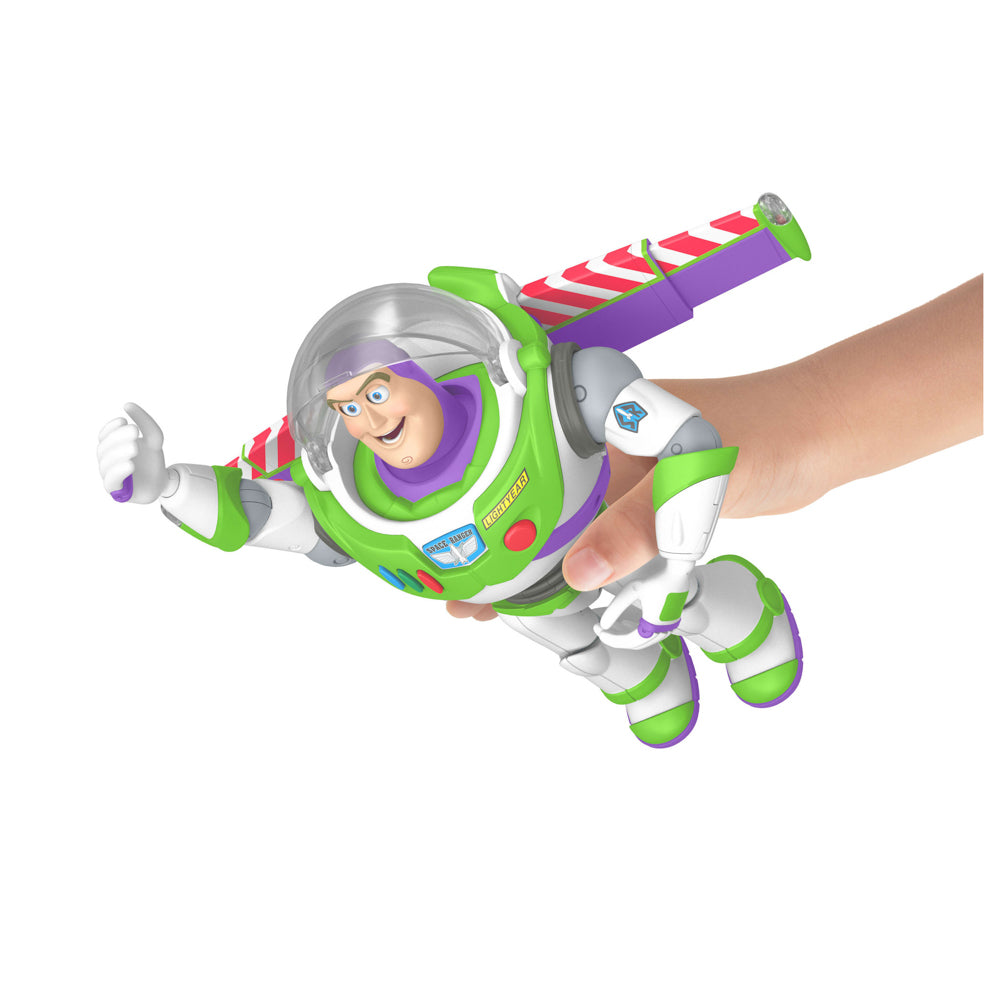 Child's hand making Buzz fly, with the Disney Pixar Toy Story 5 Ultimate Action Talking Buzz Lightyear 12 Inch Figure doll
