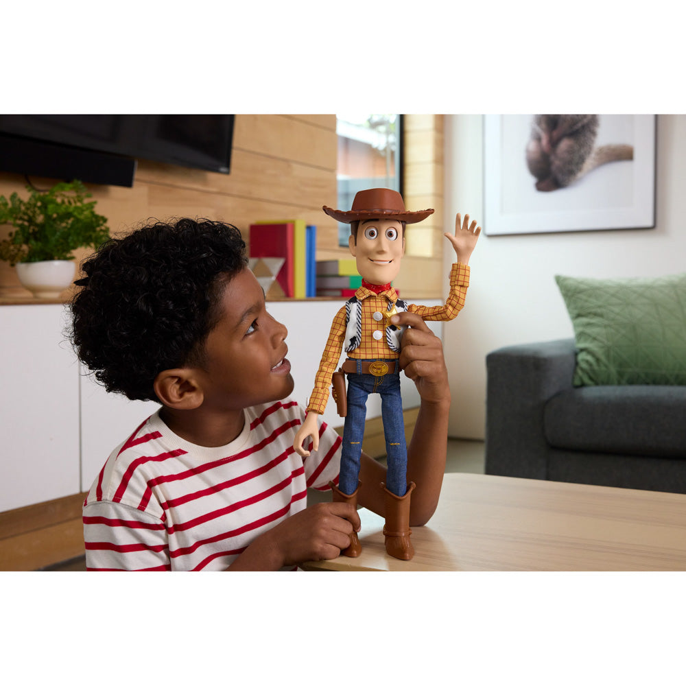 Child playing with the Disney Pixar Toy Story 5 Ultimate Action Talking Woody 16 Inch Figure doll