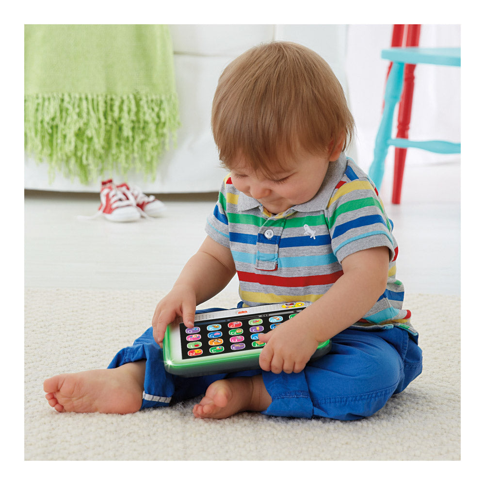 Baby playing with the Fisher-Price Laugh & Learn Smart Stages Learning Tablet Grey