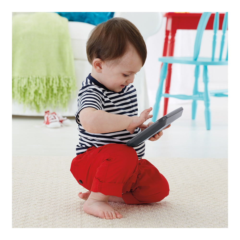 Baby playing with the Fisher-Price Laugh & Learn Smart Stages Learning Tablet Grey
