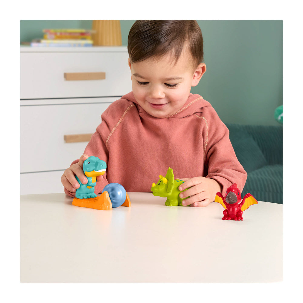 Baby playing with the Fisher-Price Little People Friendly Dinosaur Figure toy Pack