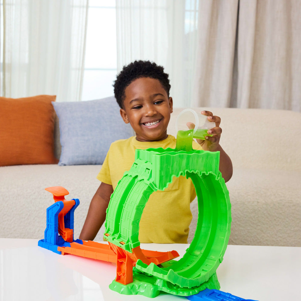 Child playing with the Hot Wheel Monster Trucks Mutant Chaos Loop Challenge playset.