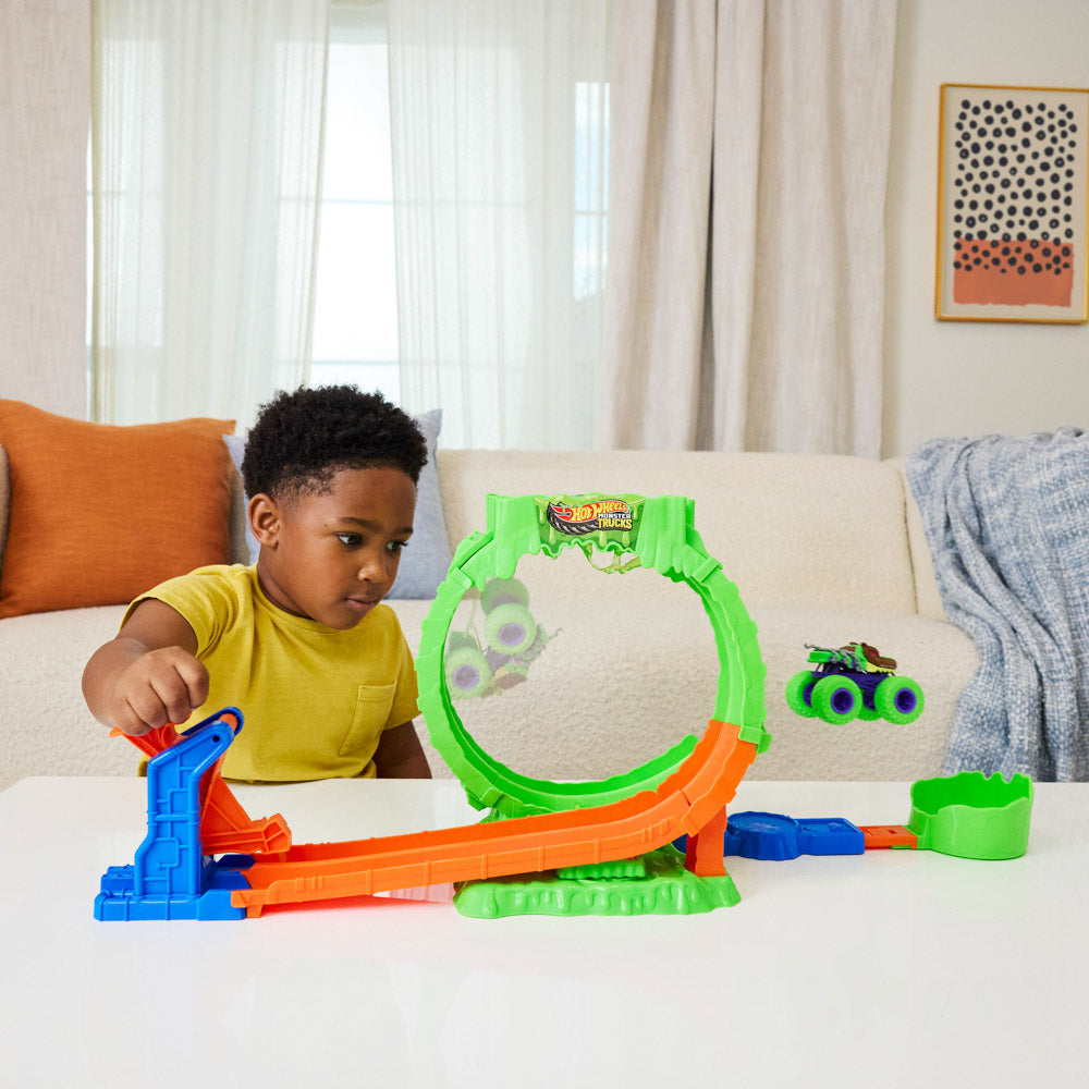 Child playing with the Hot Wheel Monster Trucks Mutant Chaos Loop Challenge playset.
