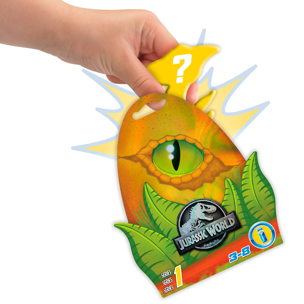 Hand holding the Pink dinosaur with movable arms and legs, from the Imaginext Jurassic World Baby Dino Blind Bag