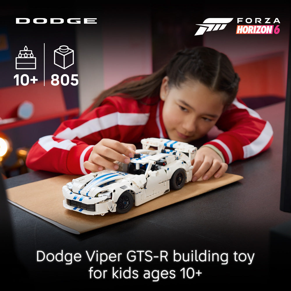 Girl playing with the assembled LEGO 42234 Technic Dodge Viper GTS-R Sports Car set.