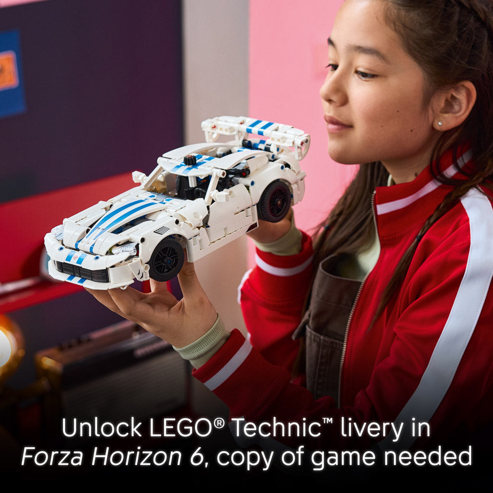Girl holding the assembled LEGO 42234 Technic Dodge Viper GTS-R Sports Car set.
