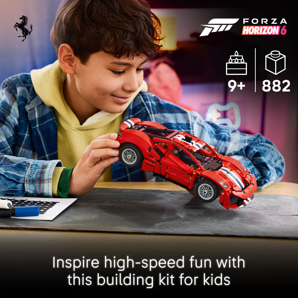 Boy playing with the assembled LEGO 42235 Technic Ferrari 488 Pista Car set.