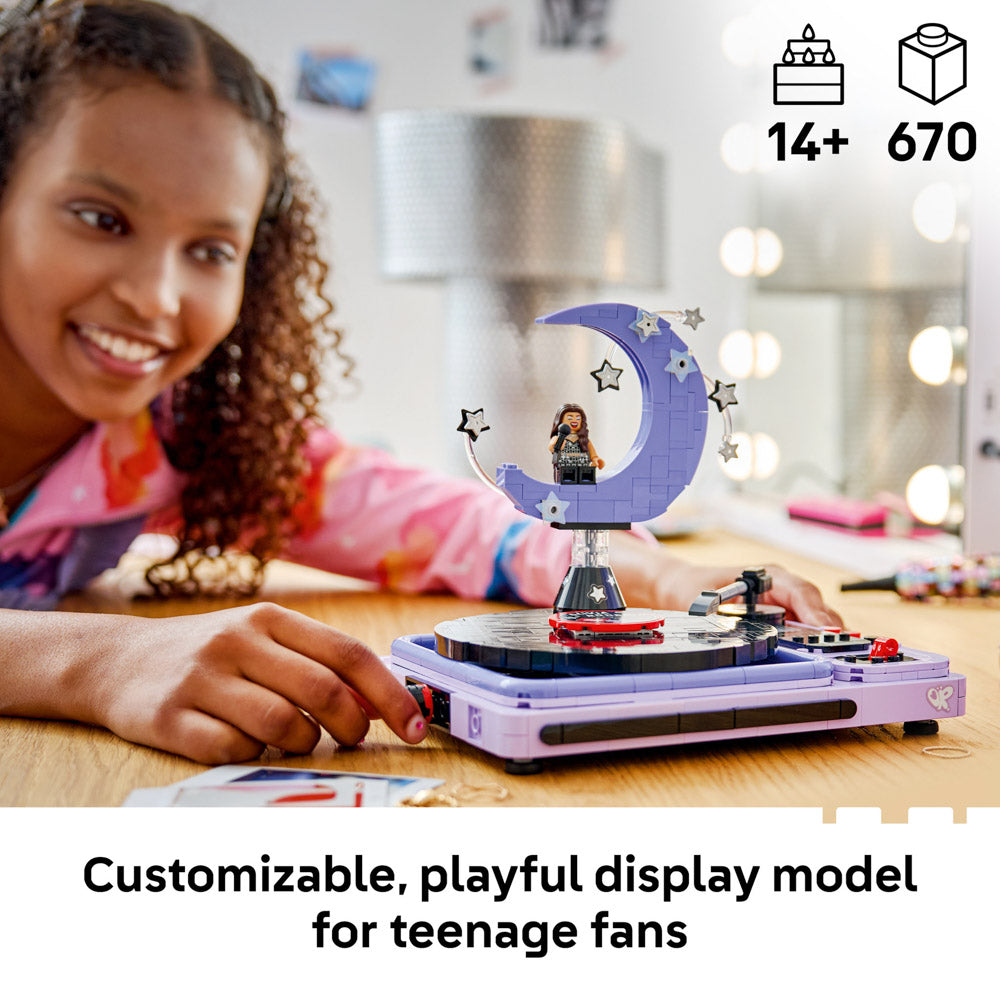 Girl displaying the assembled LEGO 43029 Editions Music Olivia Rodrigo's Concert Moon set