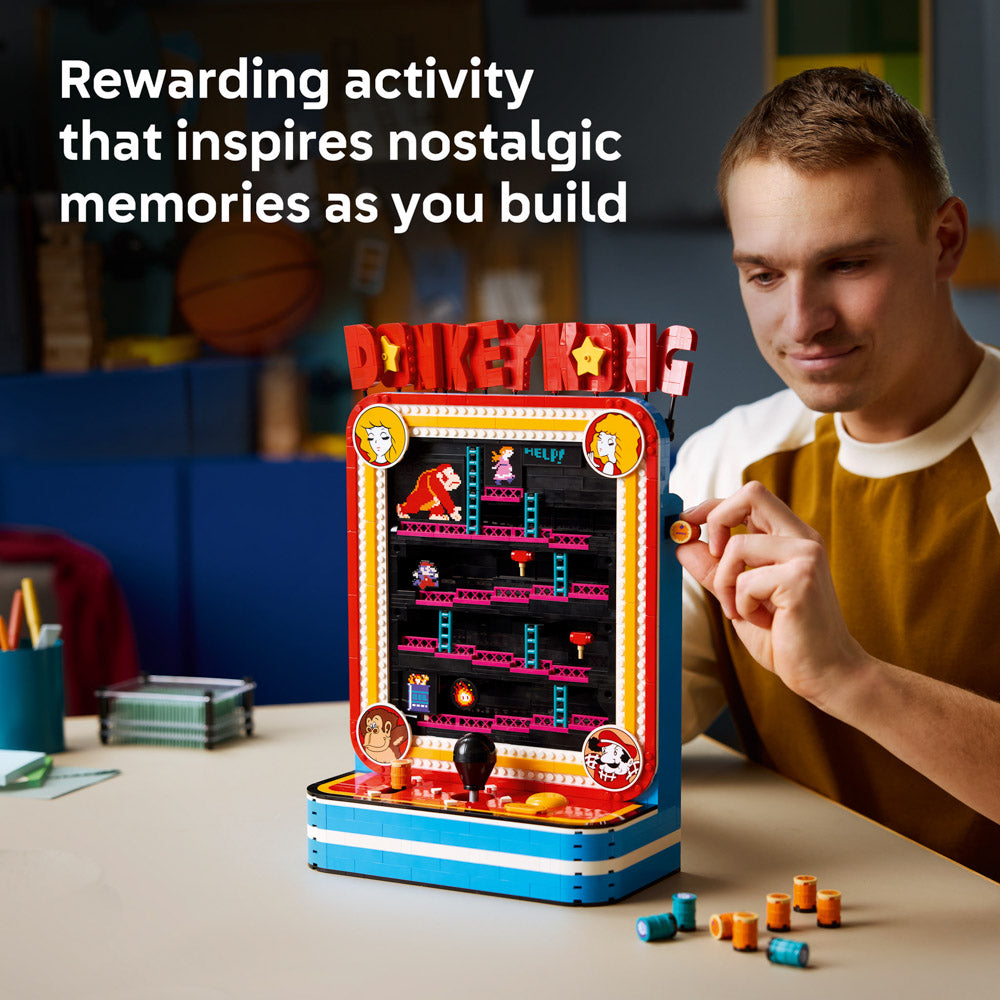 Man building the LEGO 72051 Super Mario Donkey Kong Arcade Game set.
