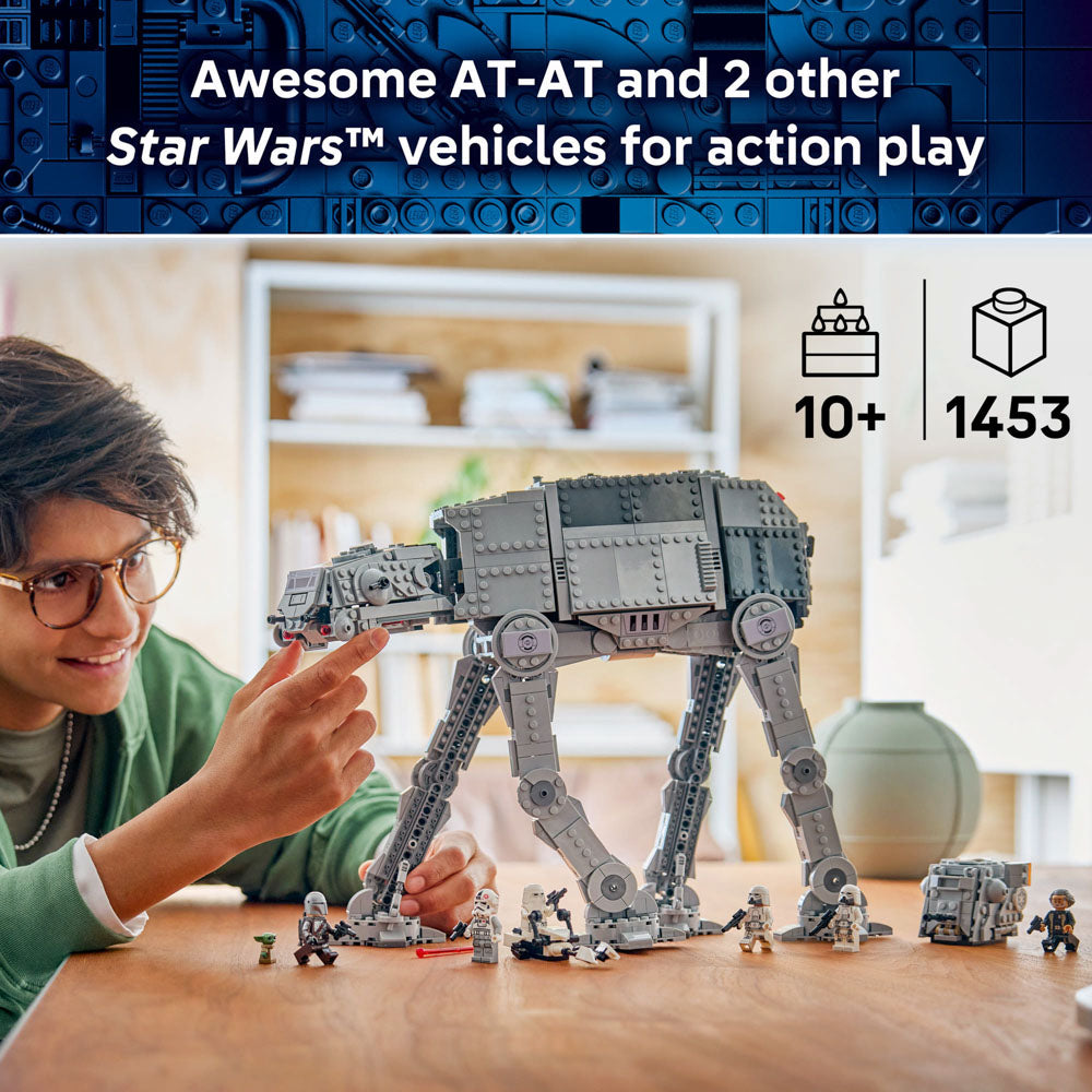 Boy building the LEGO 75454 Star Wars Imperial Remnant AT-AT with INT-4 set
