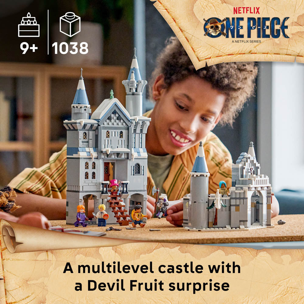 Boy playing with the assembled LEGO 75645 ONE PIECE Battle at Drum Castle set