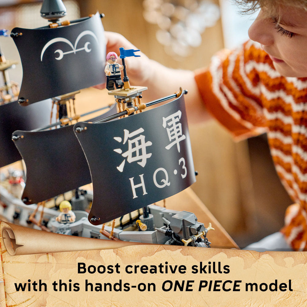 Boy building the LEGO 75646 ONE PIECE Garp's Marine Battleship Ship set