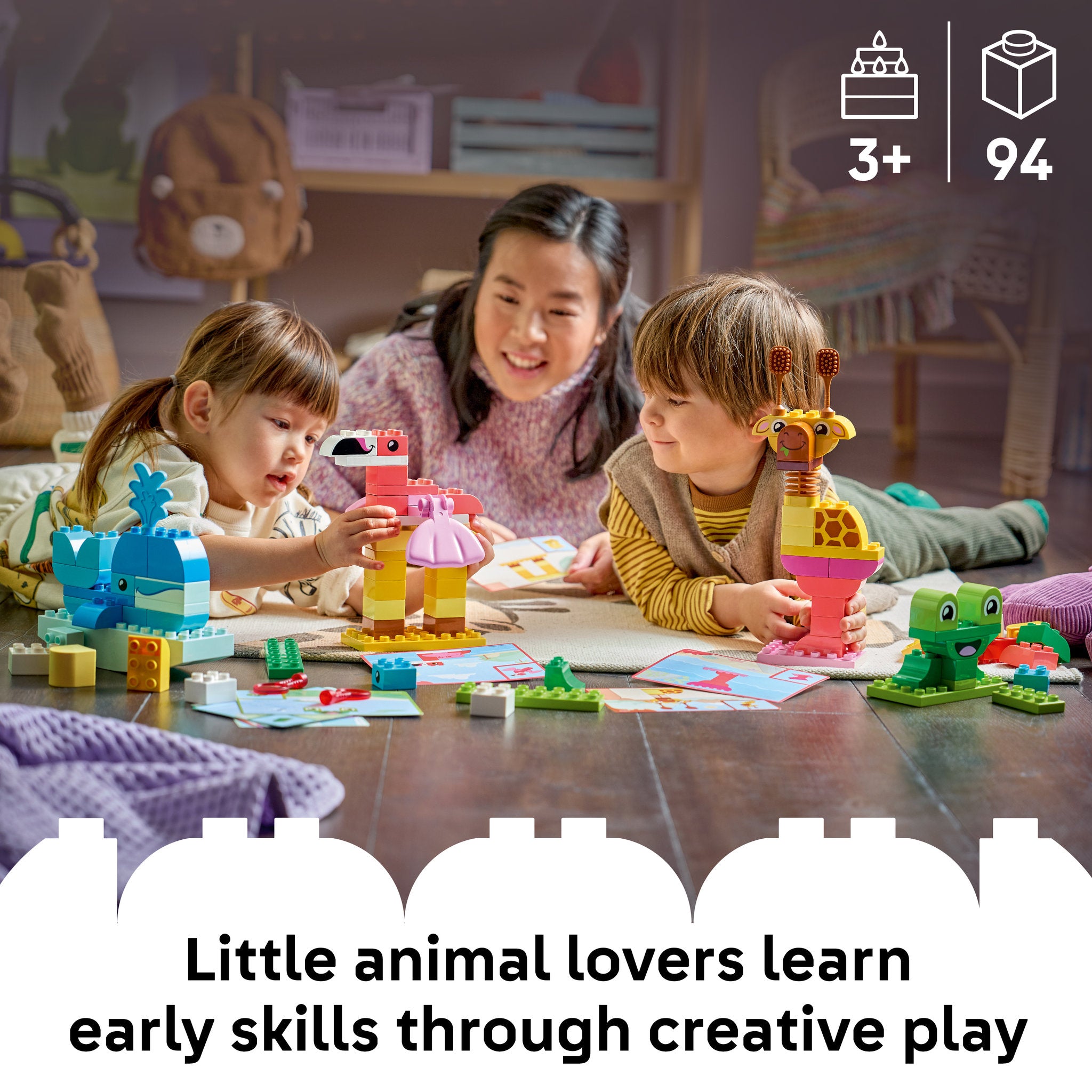 Toddlers building lego with the card game, in the LEGO 10472 DUPLO Town Animal Building Game for toddlers Set