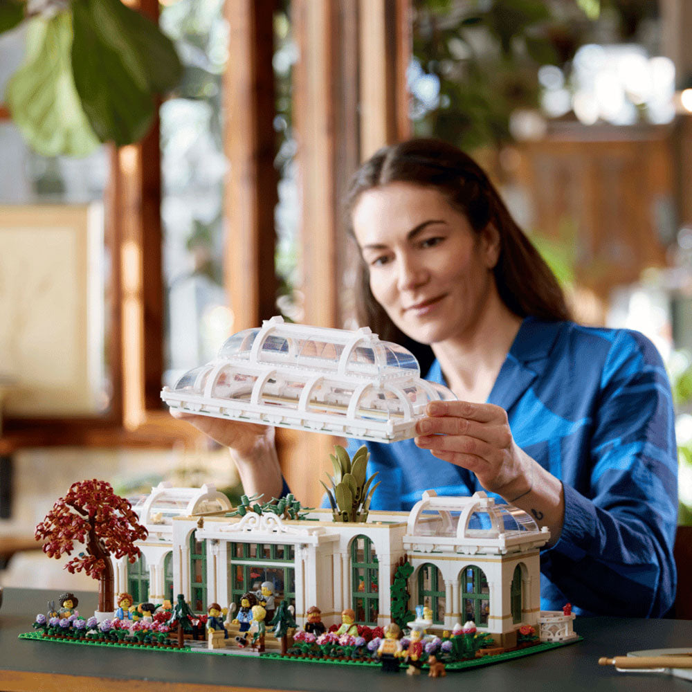 Woman building the Assembled LEGO 21353 The Botanical Garden building set