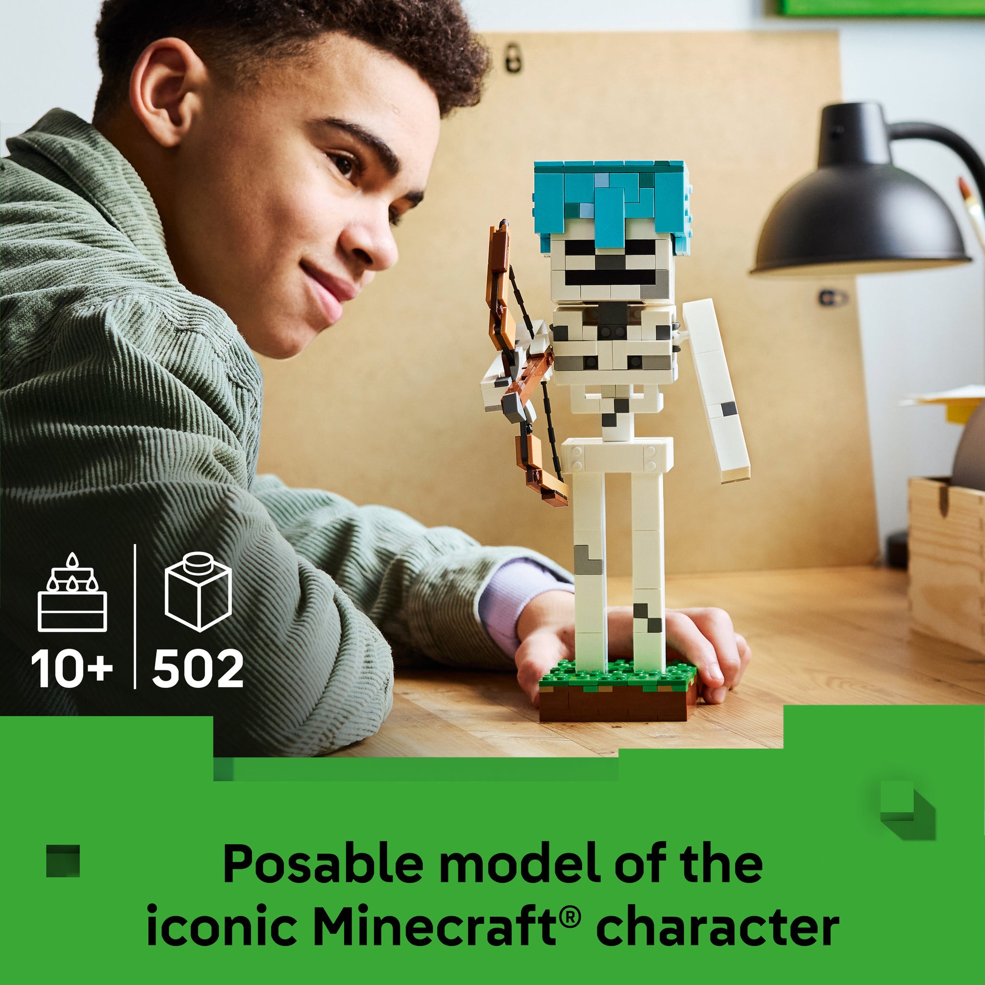 Teenager posing the assembled LEGO 21594 Minecraft The Skeleton Set
