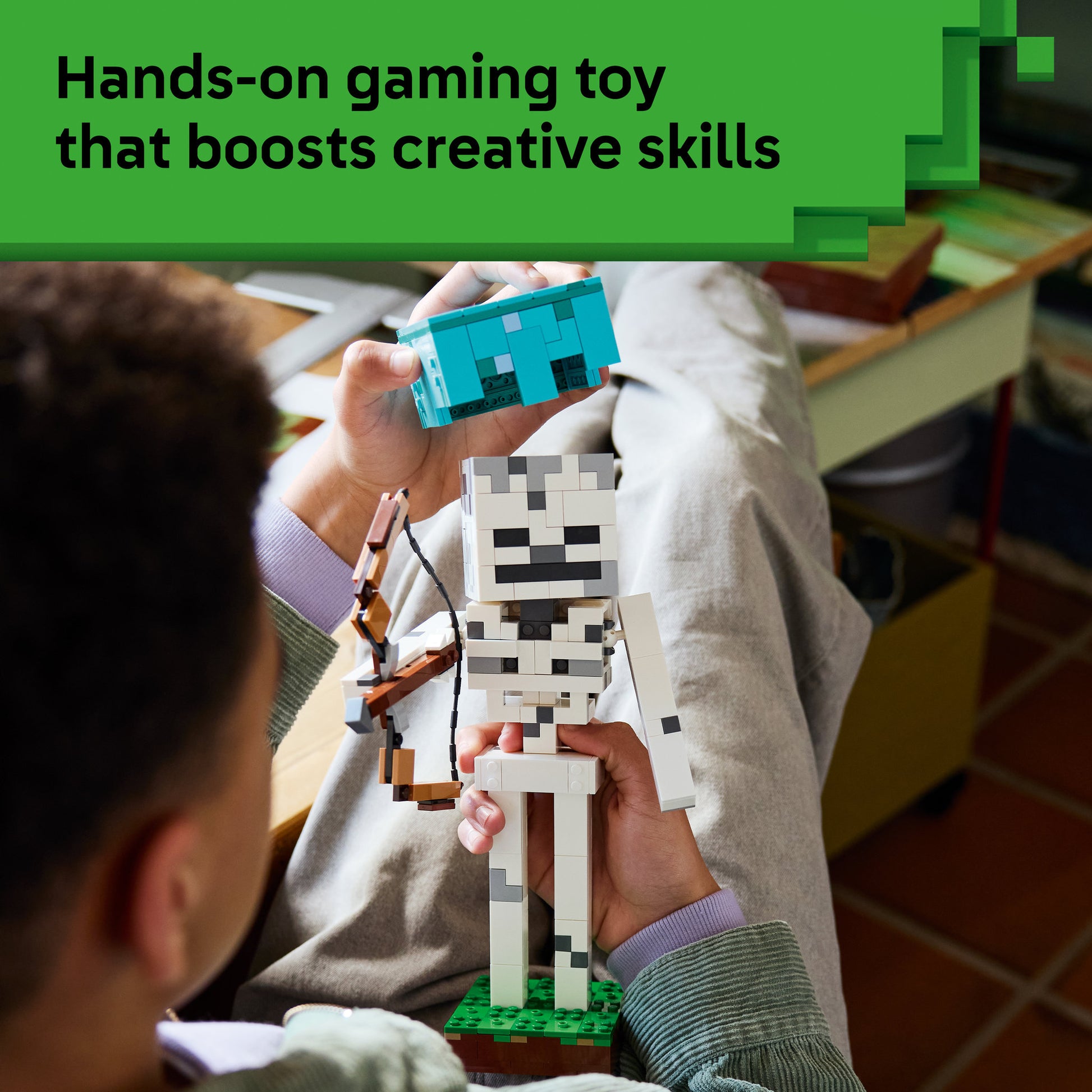 Teenager building the LEGO 21594 Minecraft The Skeleton Set