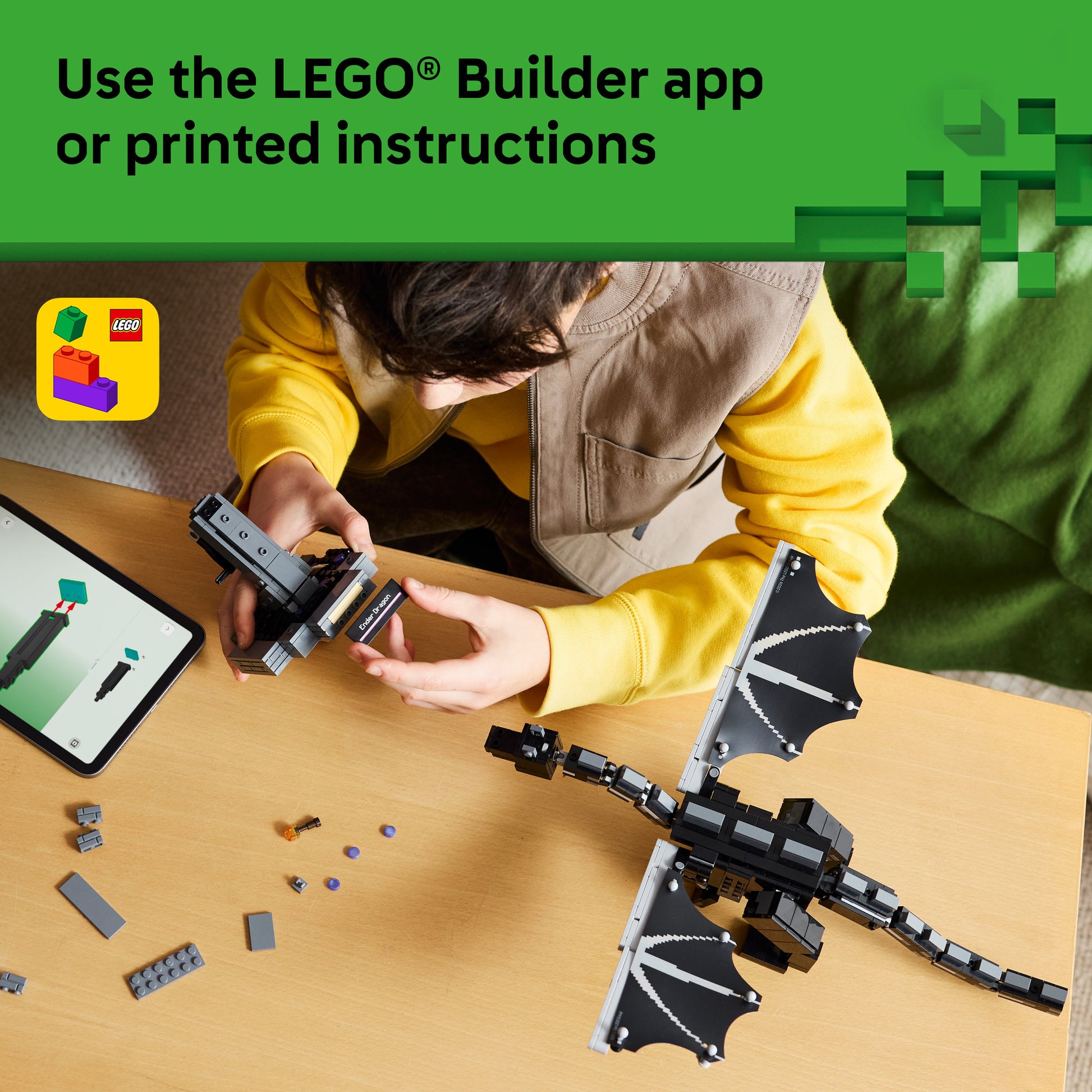 Teenager using the builder app to make the LEGO 21595 Minecraft The Ender Dragon Set