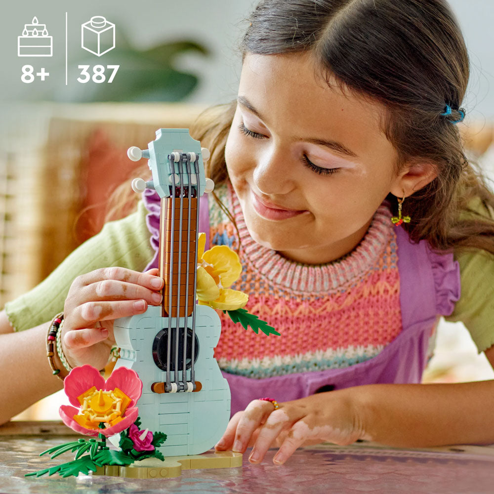 Child building the LEGO 31156 Creator Tropical Ukulele set