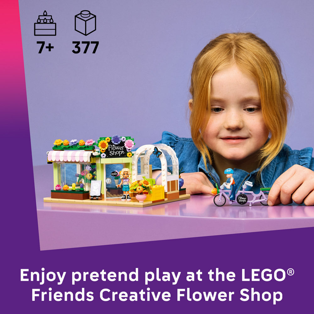 Child playing with the assembled LEGO 42693 Friends Creative Flower Shop Set