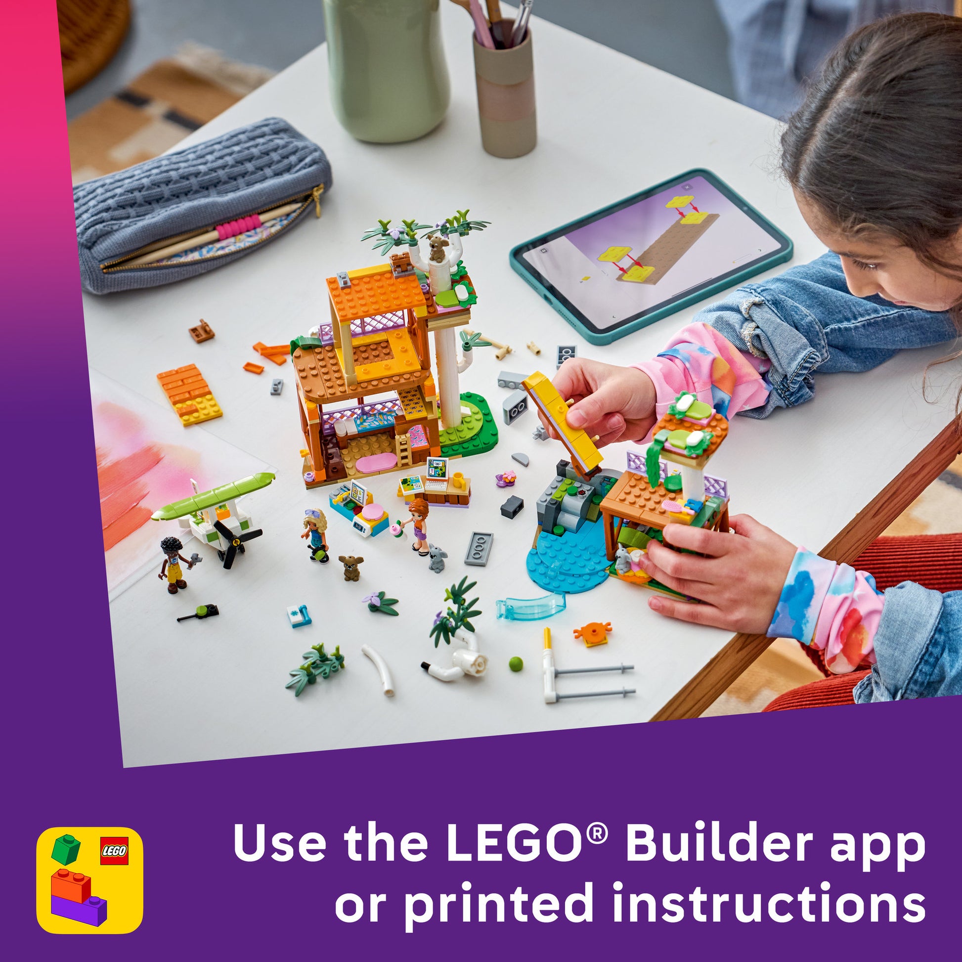 Child using the lego builder app to build the LEGO 42701 Friends Koala Habitat and Care Centre Set