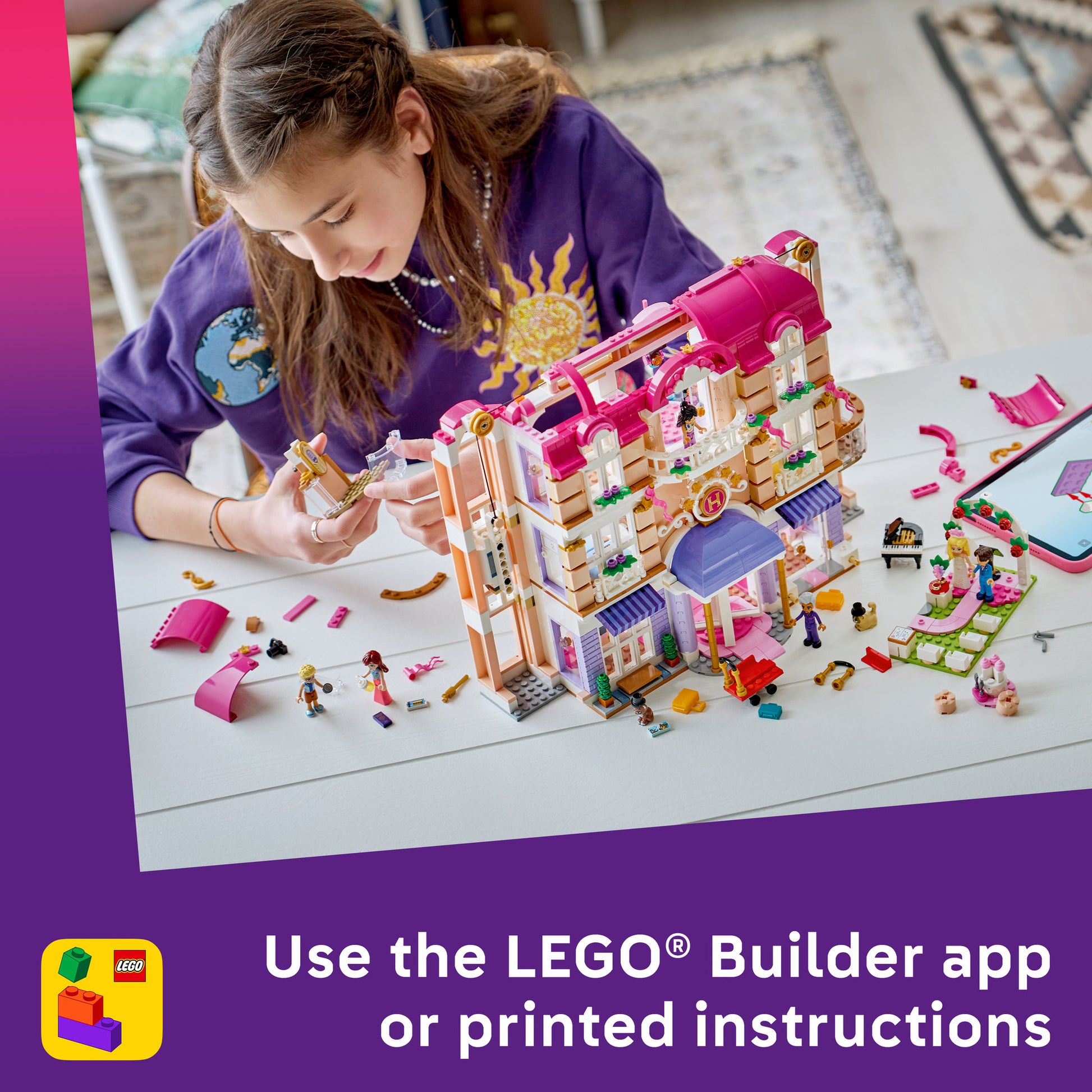 Child building the LEGO 42704 Friends Heartlake City Grand Hotel Set