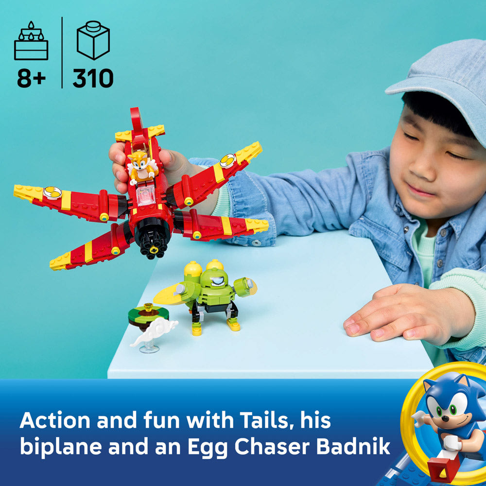 Child playing with the assembled LEGO 77119 Sonic Tails' Tornado-1 set