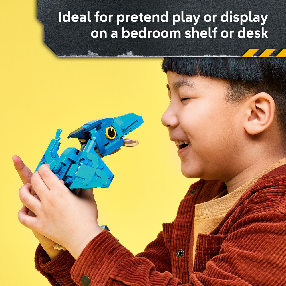 Child playing with the assembled LEGO 77977 Jurassic World Baby Dinosaur Pteranodon
