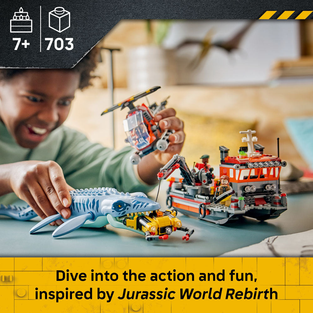 Boy playing with the assembled LEGO 77983 Jurassic World Mosasaurus Dinosaur Boat Attack set