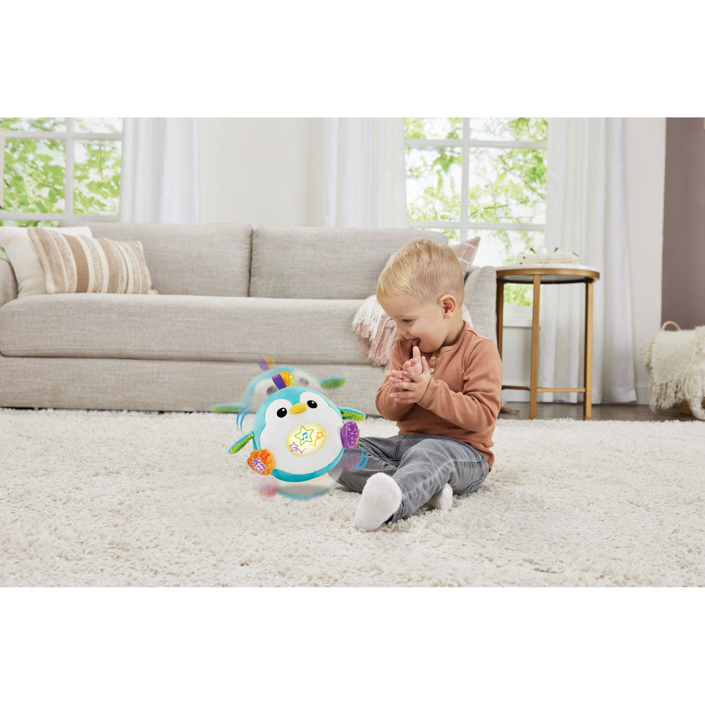 Baby playing with the LeapFrog 123 Bounce With Me Penguin toy