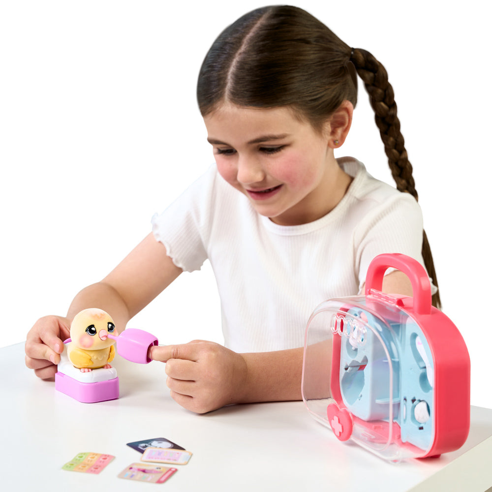 Child playing with the Little Live Pets Ouchies Series 2 Mini Chirpy Chick Bird
