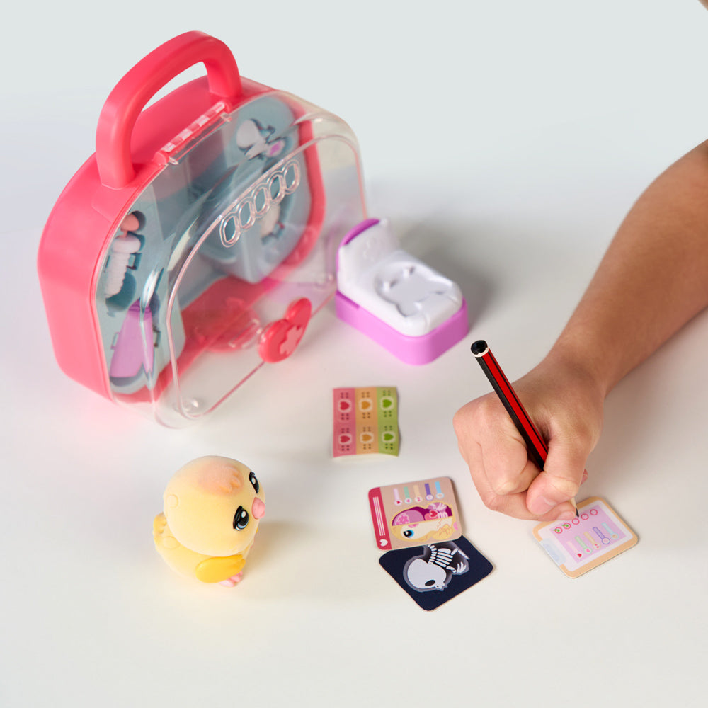 Child playing with the Little Live Pets Ouchies Series 2 Mini Chirpy Chick Bird