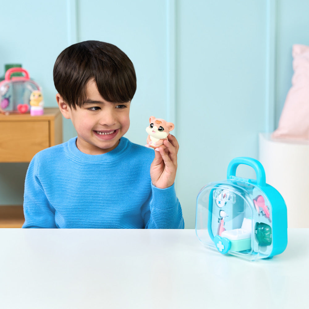 Child playing with the Little Live Pets Ouchies Series 2 Mini Coco hamster