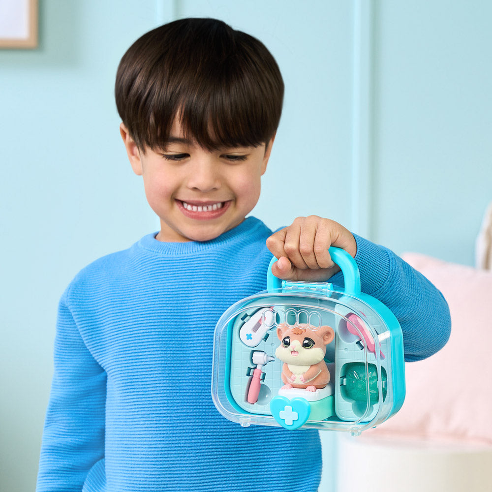 Child carrying the Little Live Pets Ouchies Series 2 Mini Coco hamster