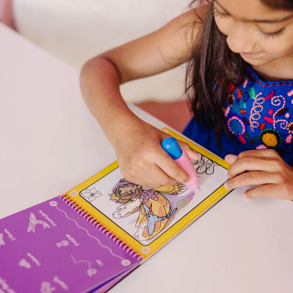 Child using the Melissa & Doug Water Wow! Water-Reveal Pad - Fairy Tale